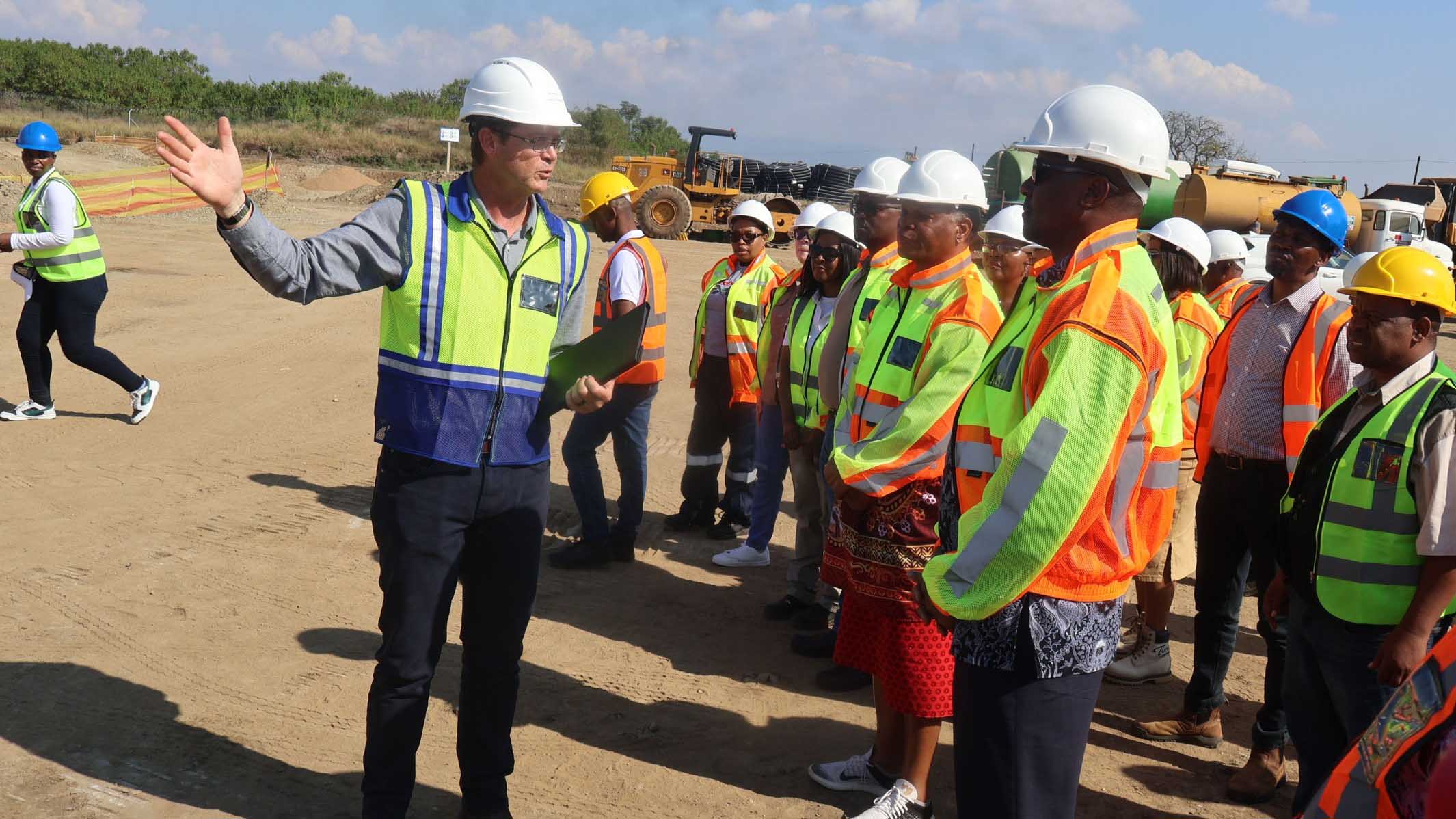 The Prime Minister Russell Mmiso Dlamini listens as he is led through the tour by Project Manager Haness Kleynhaus.